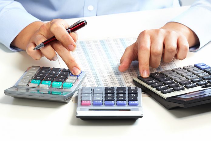Hand with calculator. Finance and accounting business.